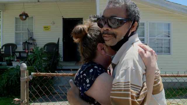 Ivory hugs his heroine Elena in their home in Algiers Louisiana Ivory hugs his heroine Elena in their home in Algiers Louisiana
