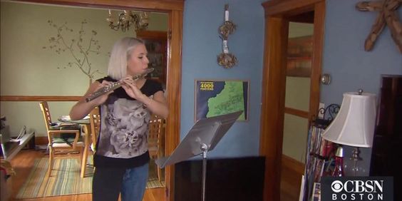 Musician Heidi Sylker playing her flute Musician Heidi Sylker playing her flute