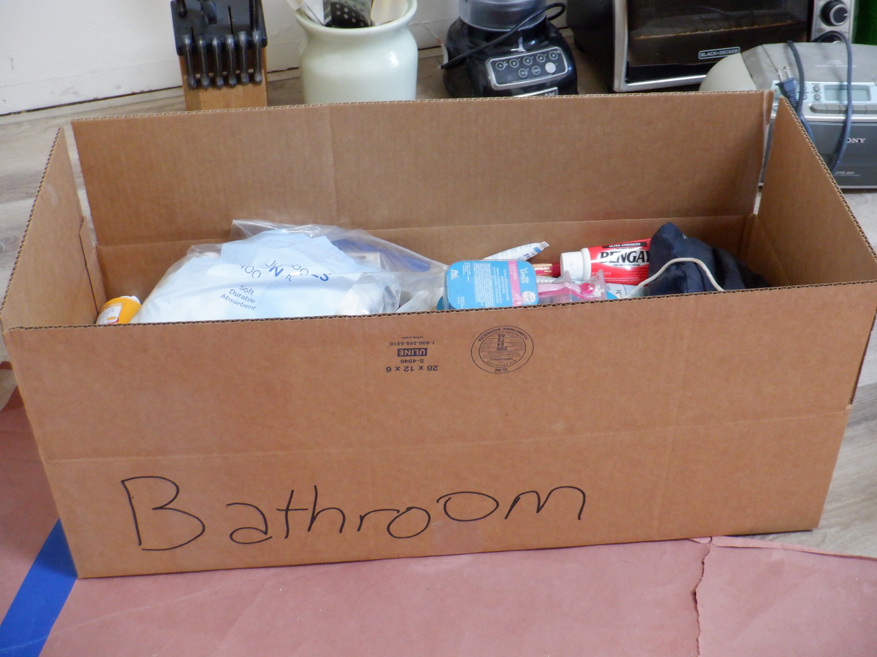 Photo I took of the first box I put stuff from my bathroom in