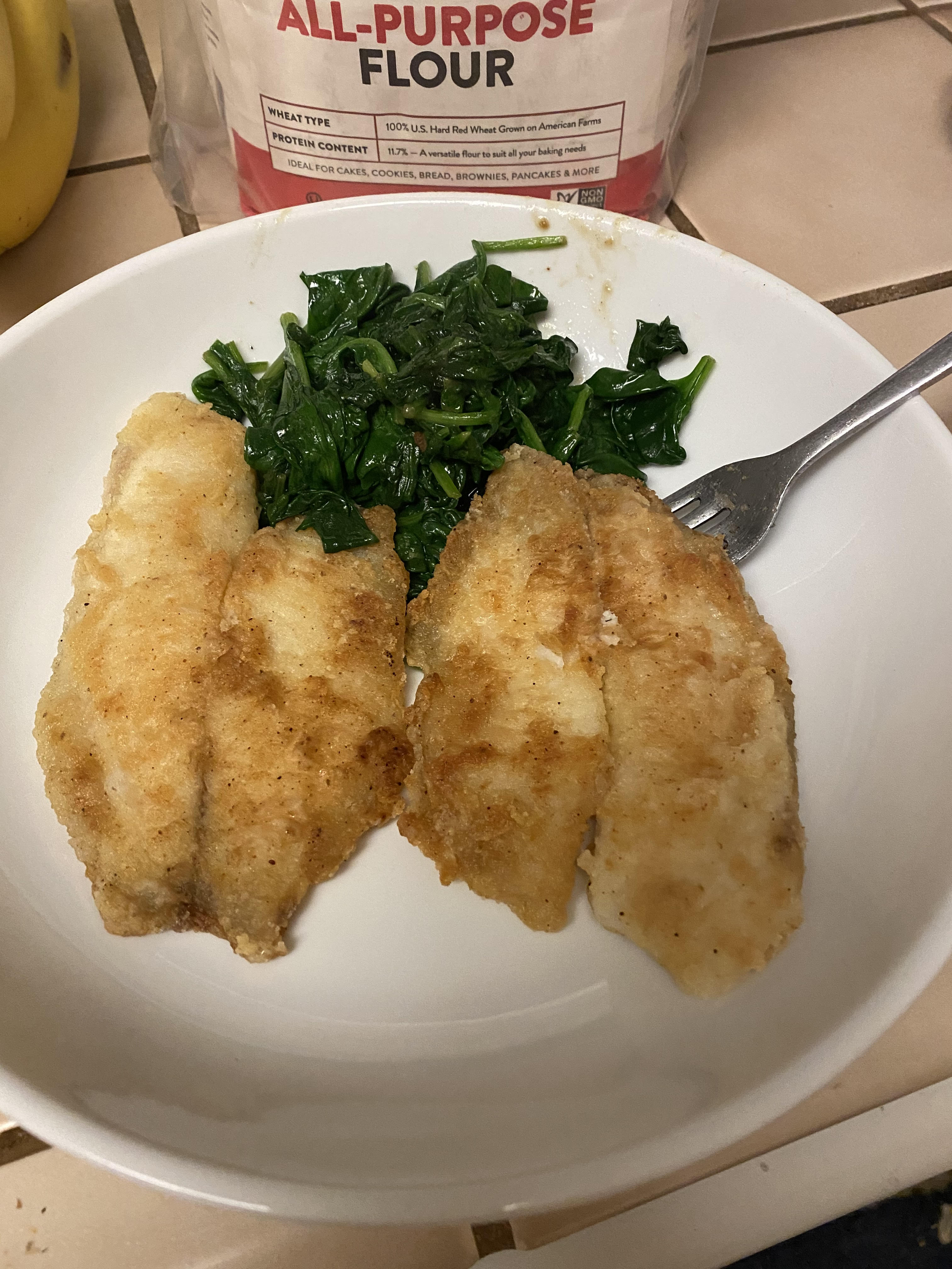 Fried tilapia and spinach! Good stuff!