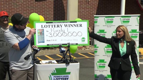 Randy Lytle, 30, showing his $3 million dollar lottery prize 