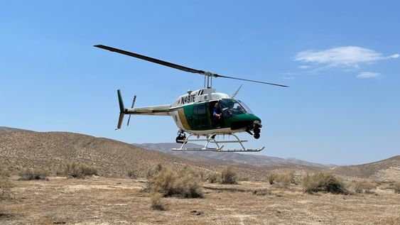 A KCSO helicopter rescuing a man who lost in Taft for over a day