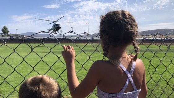 Kallie Helton looking at a helicopter in Ramona California