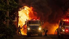 A firefighter in California saving an American flag from being burned in a fire A firefighter in California saving an American flag from being burned in a fire