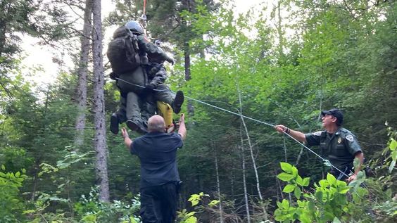 Maine game wardens assist an injured hiker on Monday