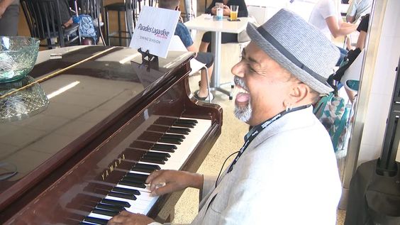 Atlanta musician Tonee Valentine playing music at an airport pizza parlor Atlanta musician Tonee Valentine playing music at an airport pizza parlor