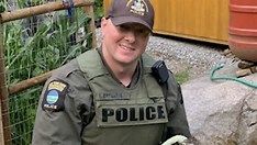 DEC Officer Crisafulli rescues a hawk that being attacked by chickens DEC Officer Crisafulli rescues a hawk that being attacked by chickens