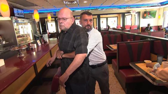 Joe Moore (L) being saved by Diner owner Dervis Atkurk on Saturday evening Joe Moore (L) being saved by Diner owner Dervis Atkurk on Saturday evening
