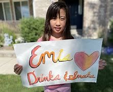 Provo Utah fourth grader Emi Kim and her lemonade sign