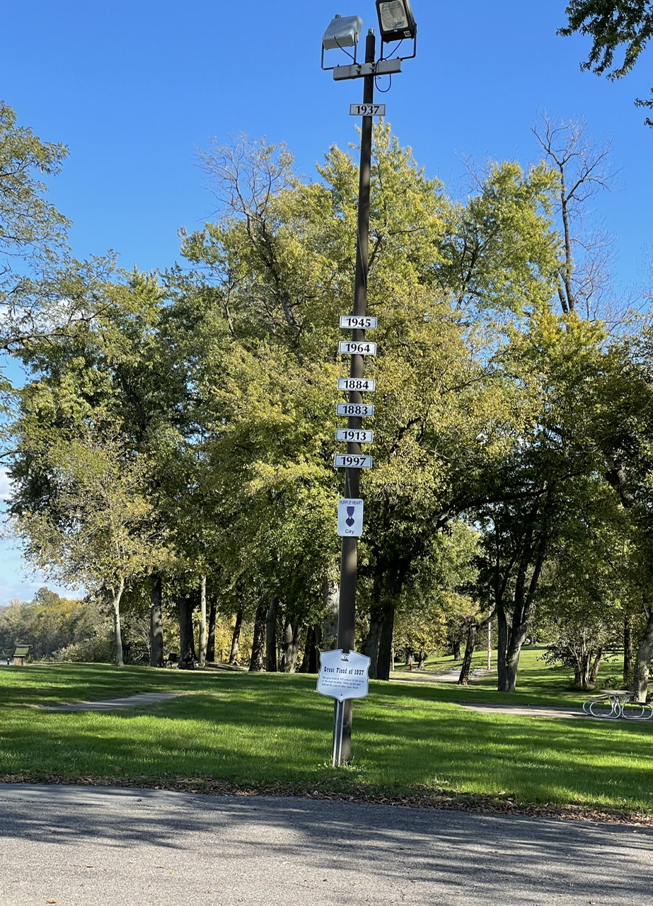 Veterans Park in West Point, Kentucky, with a light pole showing the height of the water during the 1937 flood. Photo taken by and the property of FourWalls. Veterans Park in West Point, Kentucky, with a light pole showing the height of the water during the 1937 flood. Photo taken by and the property of FourWalls.