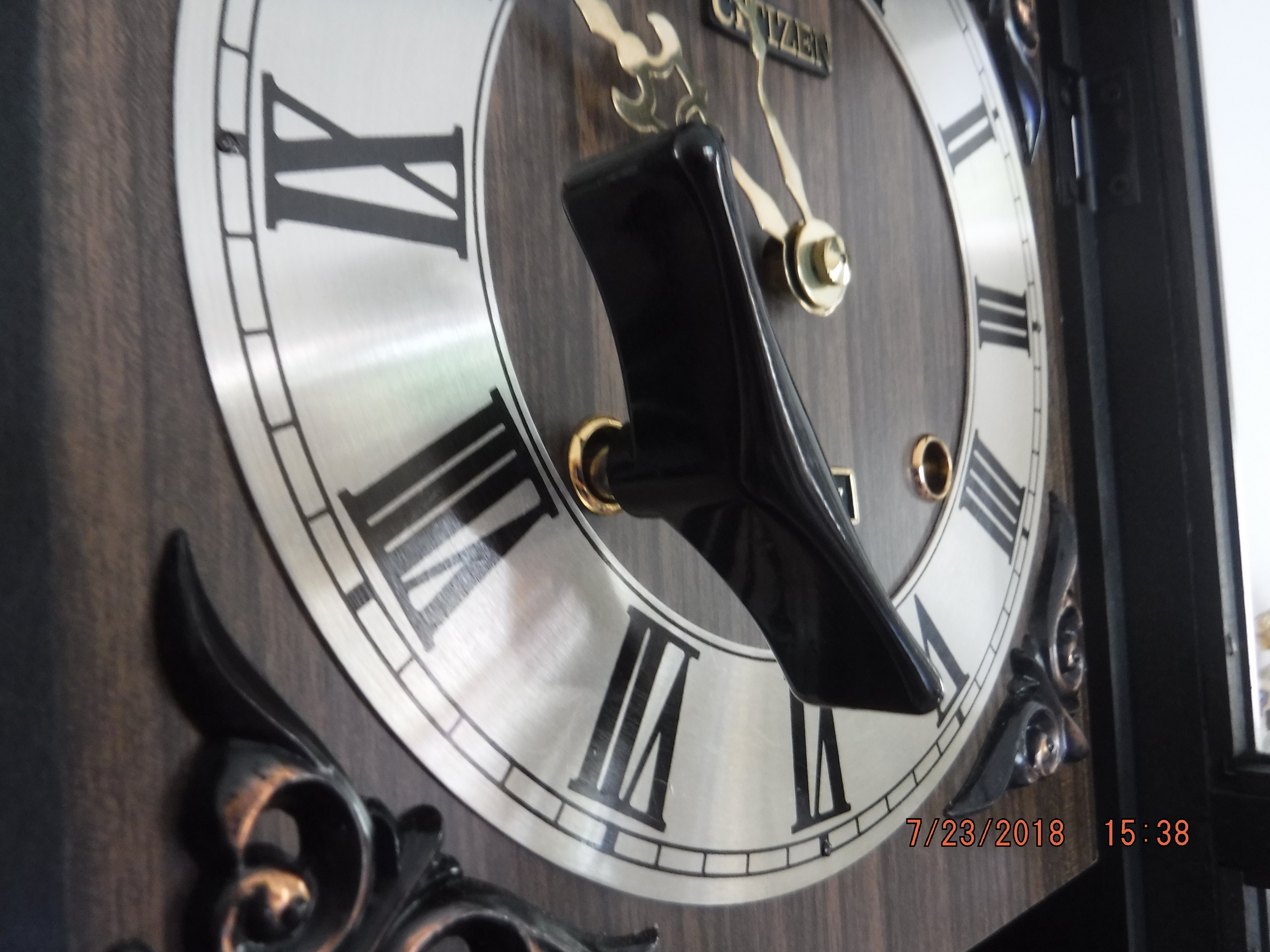 photo I took of a clock with its winding key back at my house