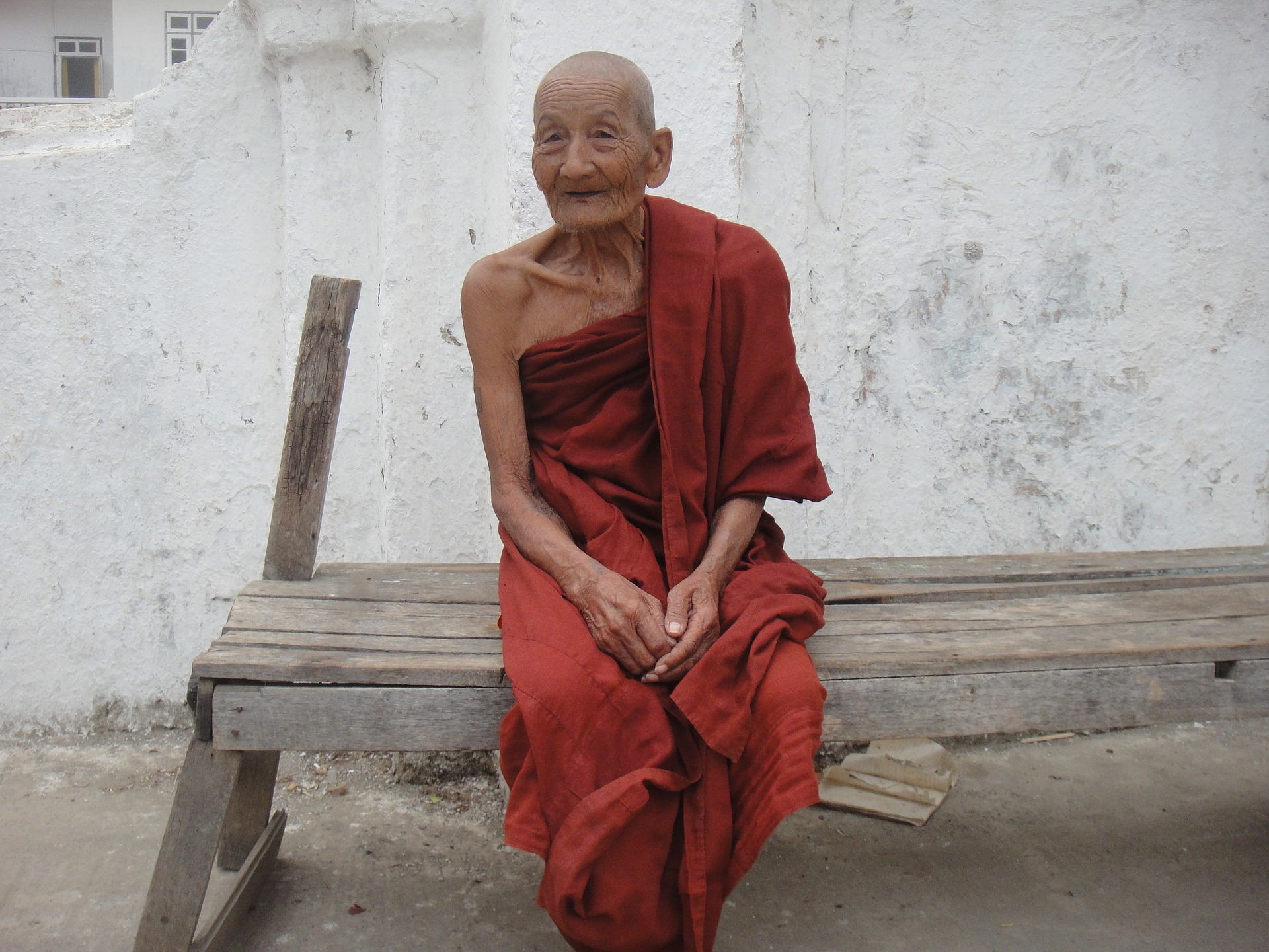 The old monk liked to sit outside on his wooden bench and give his talks from there