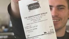 Omaha Bakery employee Preston Rath with the huge tip from Preston as his reward