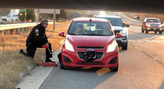 Chesterfield County Police Officer John KImenhour assisting a motorist in trouble