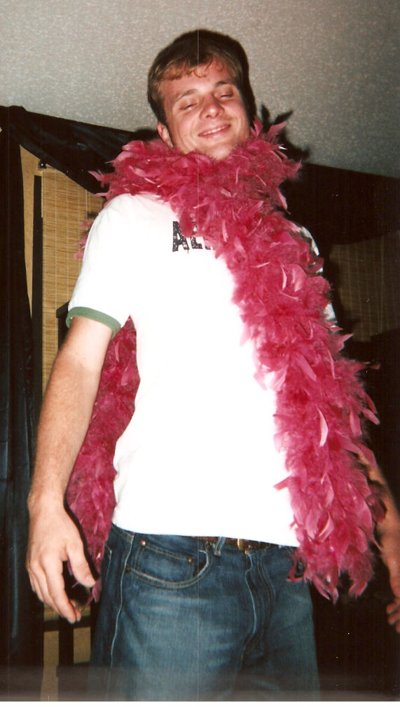 Wow Boa! - This is my man sportin our daughter's boa when we came home from New Orleans