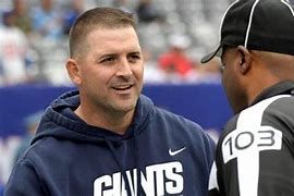 New York Giants football coach Joe Judge talking to a referee New York Giants football coach Joe Judge talking to a referee