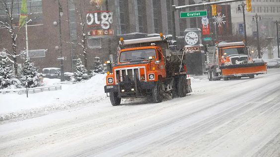 A snowplow in the streets of Detroit. A snowplow in the streets of Detroit.