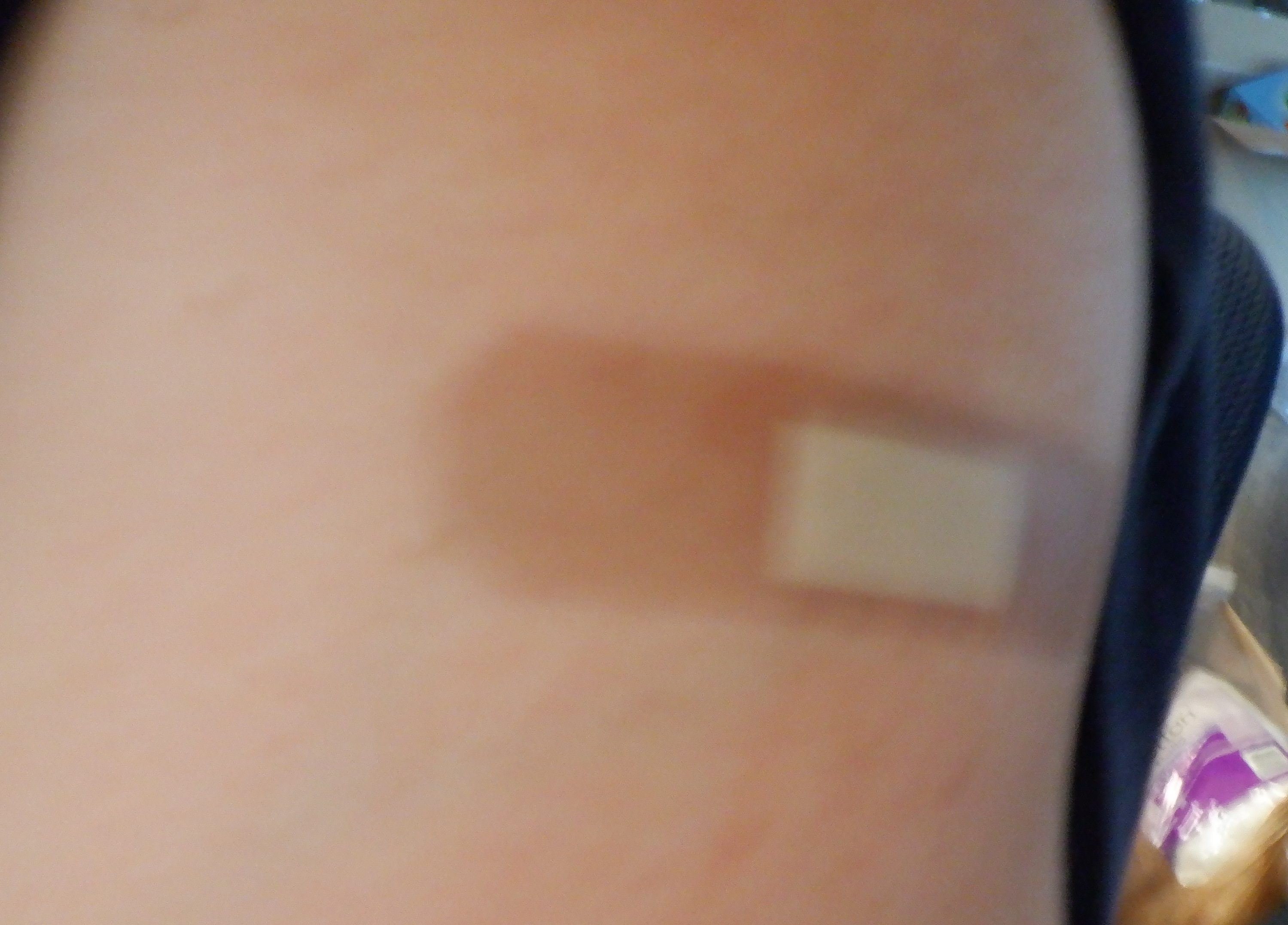 Photo I tried to take of my arm with the booster shot band-aid. Photo I tried to take of my arm with the booster shot band-aid.