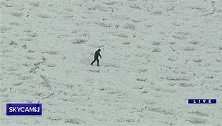 A college student in Chicago walking on Lake Michigan on Friday morning. A college student in Chicago walking on Lake Michigan on Friday morning.