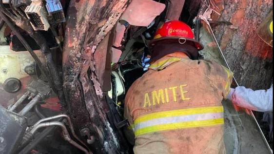 Tangipahoa Parush Firefighters rescue an injured truck driver on Sunday morning. Tangipahoa Parush Firefighters rescue an injured truck driver on Sunday morning.