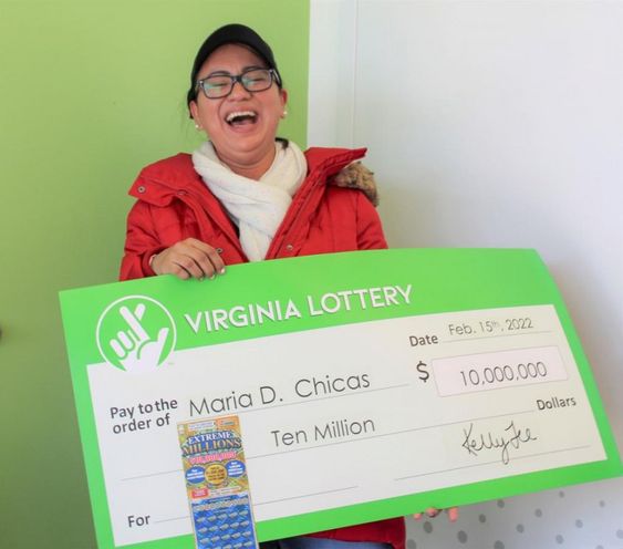 Maria Chicas with her huge lottery prize ticket in Virginia. Maria Chicas with her huge lottery prize ticket in Virginia.
