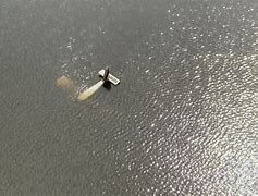 The image of a Piper Cherokee plane in the Savannah River in Georgia