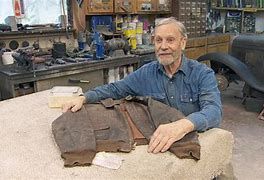 Pat Nesbitt with a World War II jacket that was returned to the relative of the owner