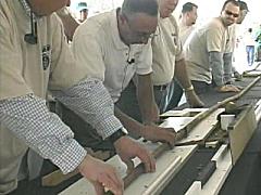 Giant Cigar - Picture shows men rolling a 101-Foot Cigar. Giant Cigar - Picture shows men rolling a 101-Foot Cigar.