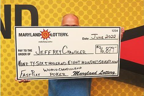 Maryland resident Jeffrey Chandler with his winning lottery prize money Maryland resident Jeffrey Chandler with his winning lottery prize money