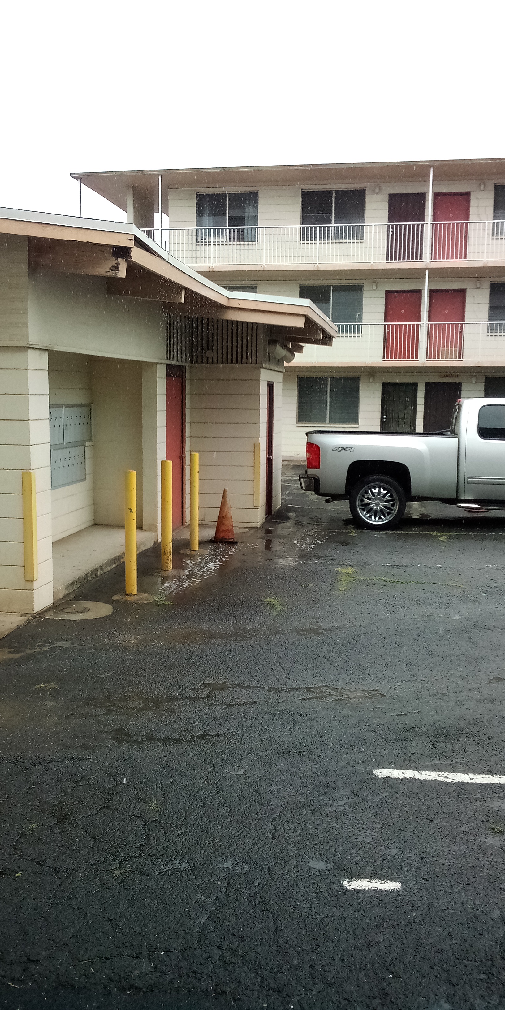 Parking lot, looking at mail boxes if home. Parking lot, looking at mail boxes if home.