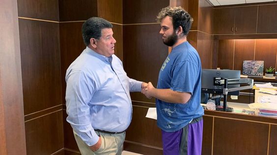 Lafayette Mayor Tony Roswarski (L) shaking hands with Nicolas Bostic the savior. Lafayette Mayor Tony Roswarski (L) shaking hands with Nicolas Bostic the savior.
