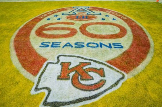 The logo of the Kansas City Chiefs 60th year anniversary on the football field.