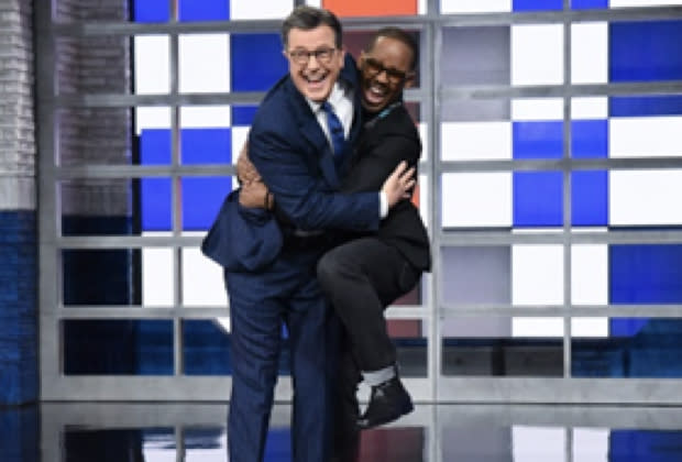Louis Cato jumps for joy into the arms of Stephen Colbert