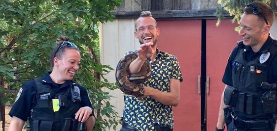 Miles in the middle with the missing snake Lucille Ball and two Bozeman police officer. Miles in the middle with the missing snake Lucille Ball and two Bozeman police officer.