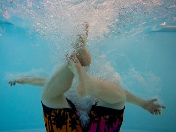 A young boy swimming in a pool in Indiana A young boy swimming in a pool in Indiana