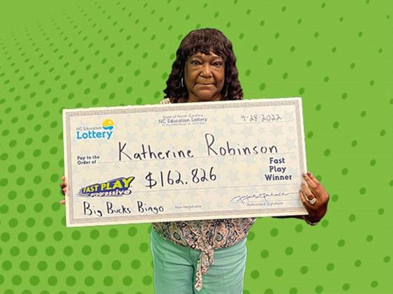 Apex North Carolina resident Katherine Robinson with her winning lottery ticket.