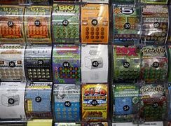 Images of scratch off lottery tickets inside of a grocery store. Images of scratch off lottery tickets inside of a grocery store.