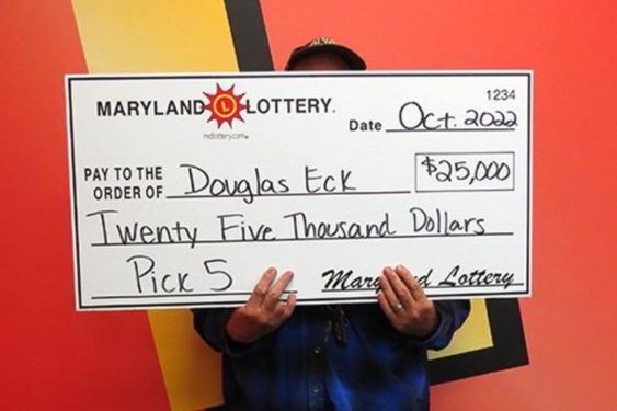 Joppa Maryland resident Douglas Eck with his winning prize money playing the lottery