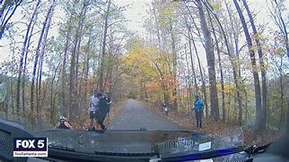 Police camera showing a police officer giving CPR to a heart attack victim. Police camera showing a police officer giving CPR to a heart attack victim.