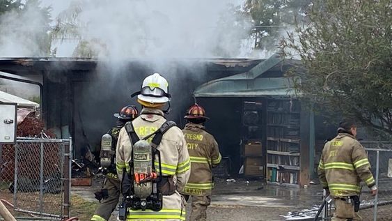 Fresno firefighters at the sight of a housefire this morning. Fresno firefighters at the sight of a housefire this morning.