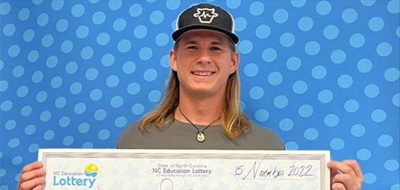 Asheboro North Carolina resident Jacob Strickland with his lottery prize ticket. Asheboro North Carolina resident Jacob Strickland with his lottery prize ticket.