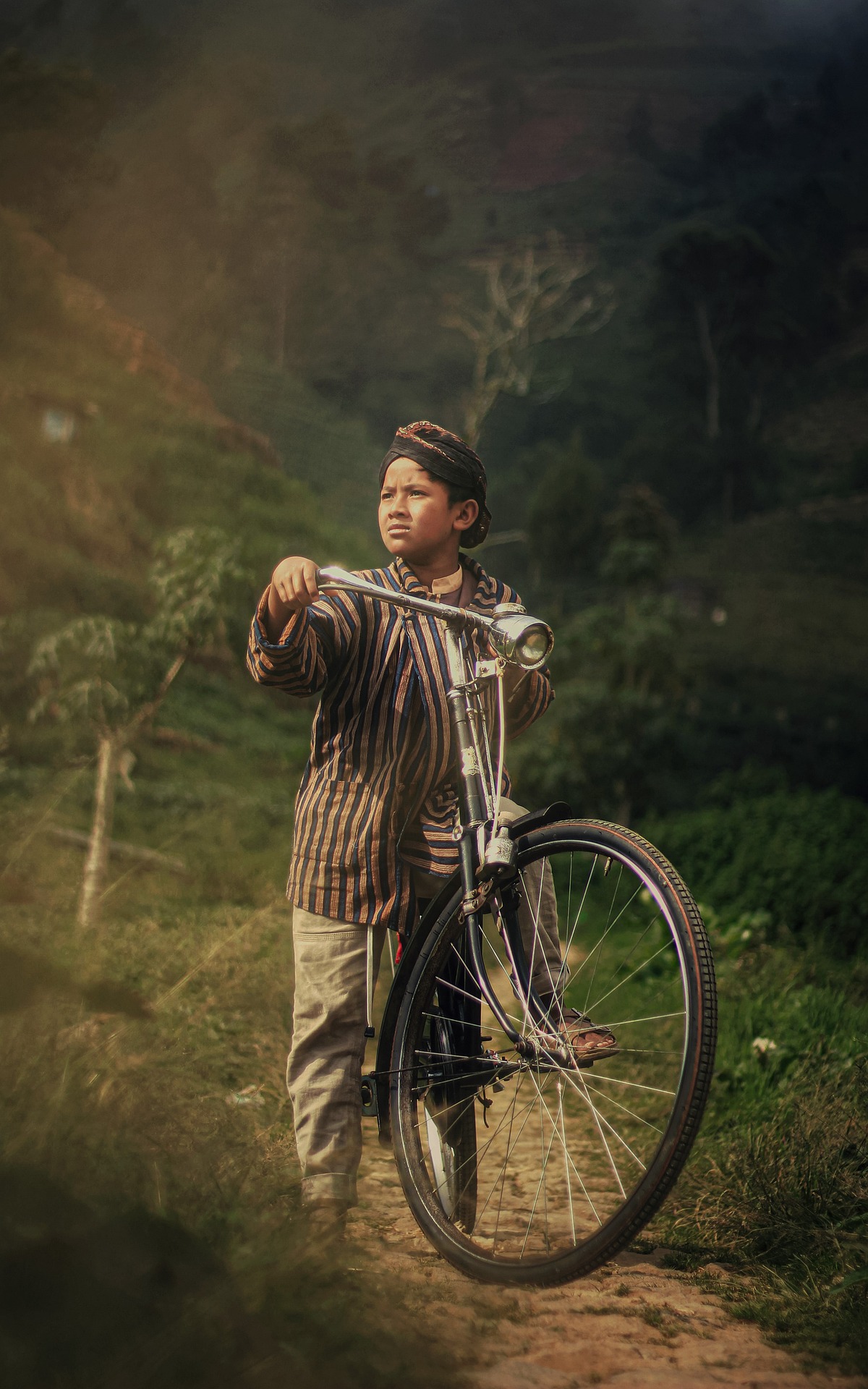 The boy gave his bicycle to his master to try to ride it