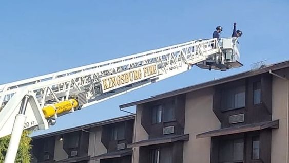 Kingsfield Firefighters rescuing a cat on a roof in California