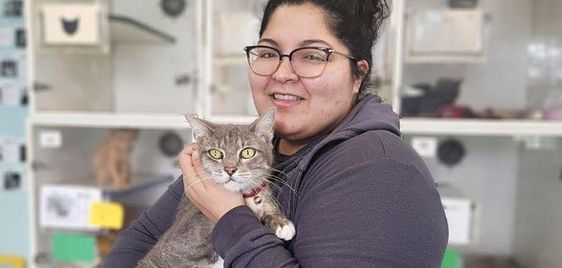 Stephanie Garza with her cat Ollie who reunited with her owner after 5 years apart