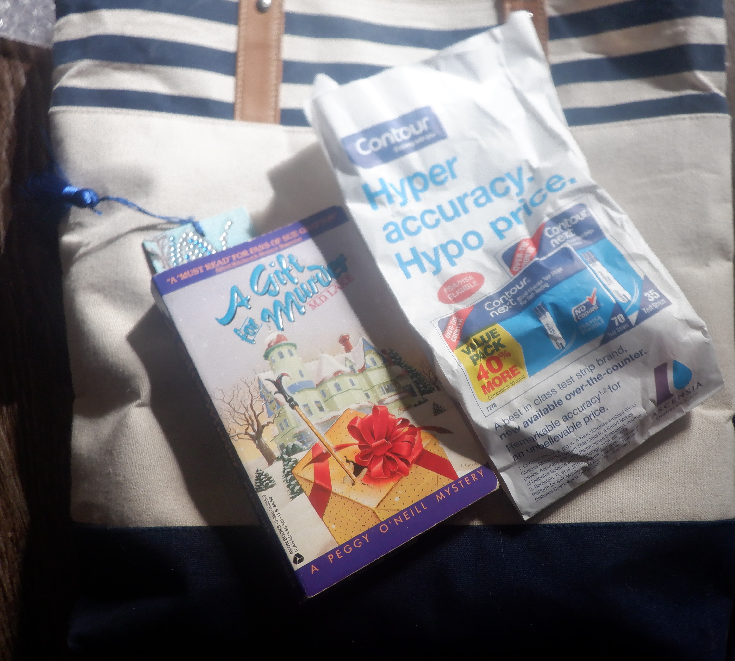 Photo I took of my tote and book I brought, plus bag of meds I picked up Photo I took of my tote and book I brought, plus bag of meds I picked up