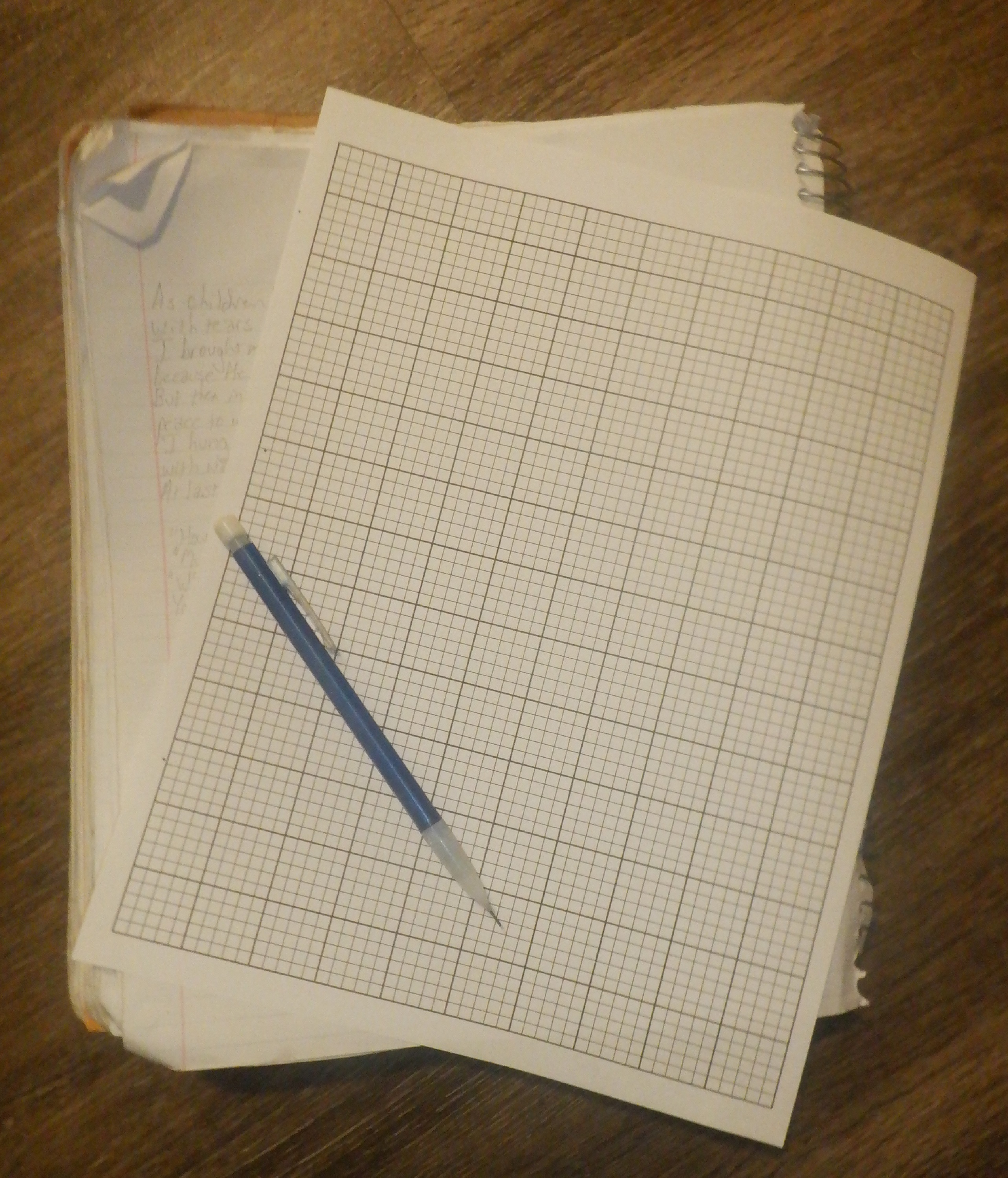 Photo I took of the notebook I wrote the poem down in, and graph paper I printed out Photo I took of the notebook I wrote the poem down in, and graph paper I printed out