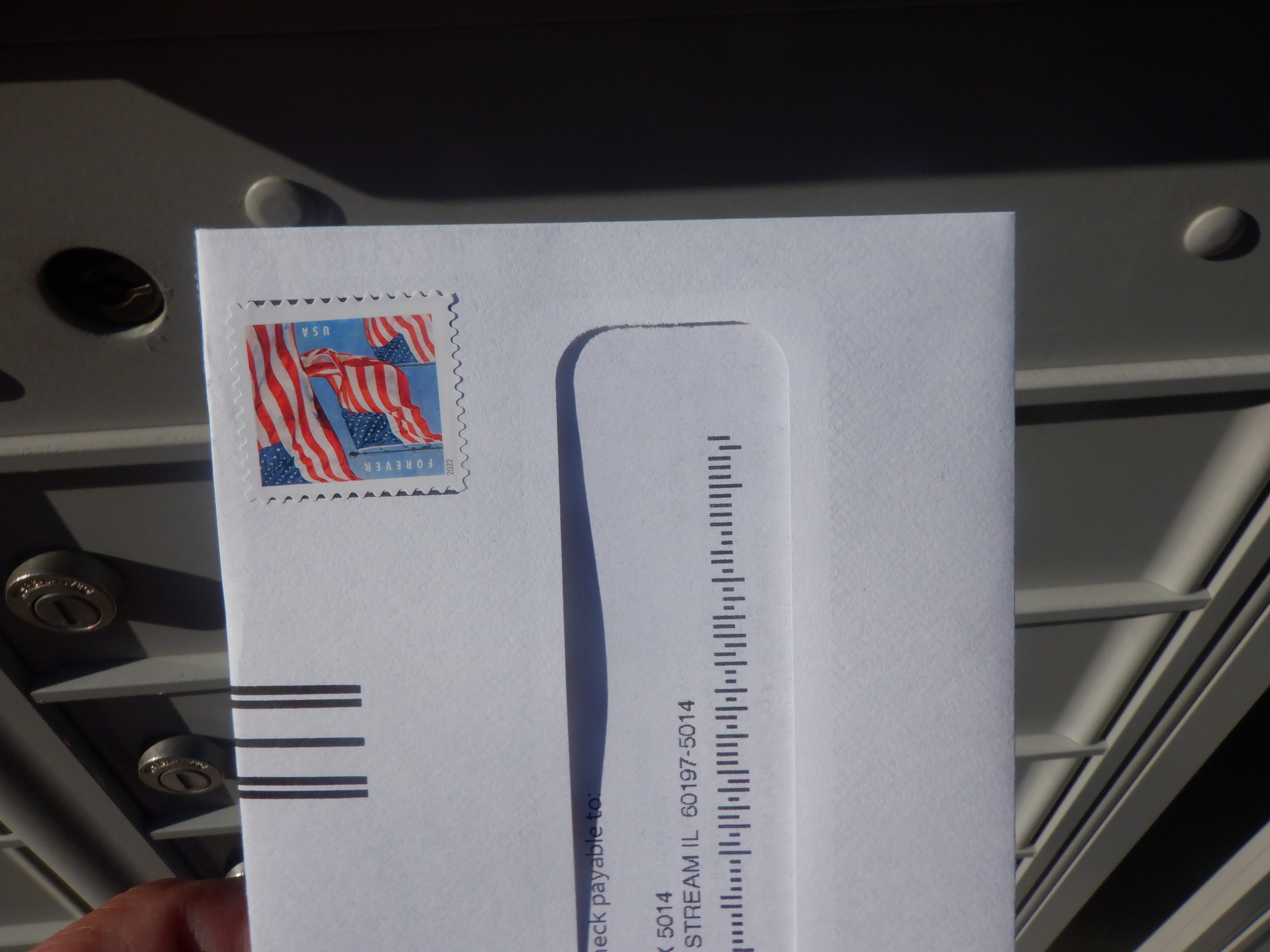 photo of mail delivered to the mailbox