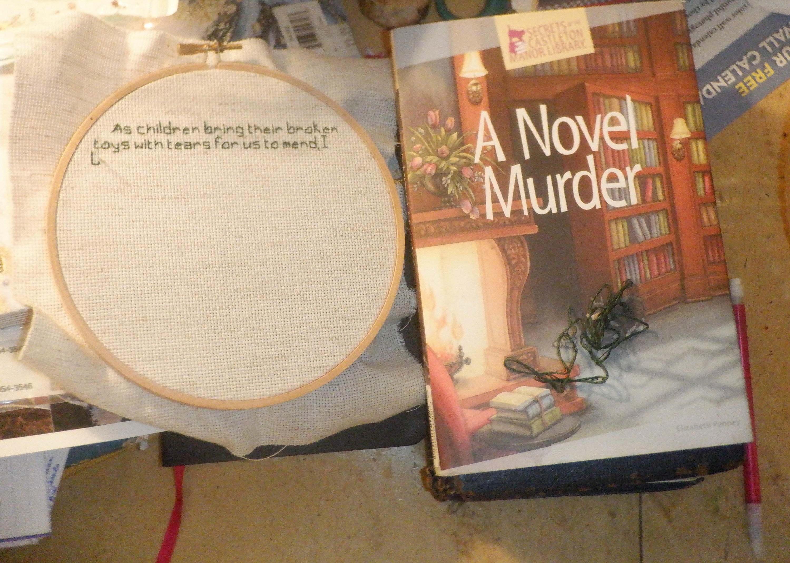 photo I took of the cross stitch I'm working on and the book I'm reading photo I took of the cross stitch I'm working on and the book I'm reading