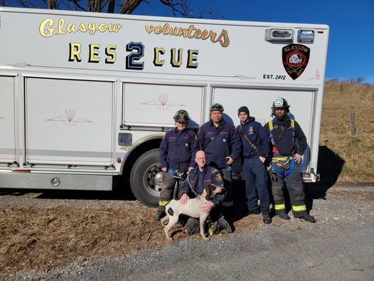 Firefighters in Glasgow Virginia pose with Bradley the dog and her owner Firefighters in Glasgow Virginia pose with Bradley the dog and her owner