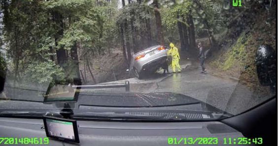 An auto on a road in Santa Cruz California on the edge of a cliff. An auto on a road in Santa Cruz California on the edge of a cliff.